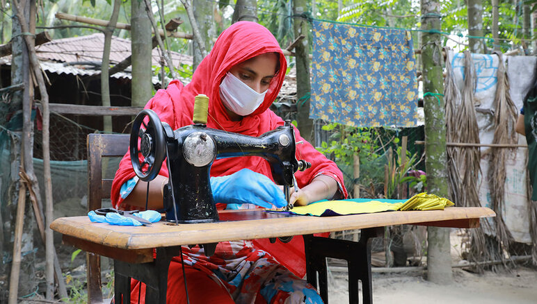 During the covid-19 pandemic, in Cox's Bazar, Bangladesh, WFP engaged with women from the host community and Rohingya refugees through its livelihood program to make masks that were distributed by local government and humanitarian agencies giving them a monthly stipend, marketable job training and financial literacy, and a scholarship to start a business. WFP/Nalifa Mehelin